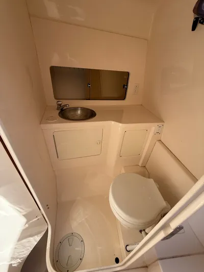  Yacht Photos Pics Compact bathroom in a 2000 Intrepid 356 boat.