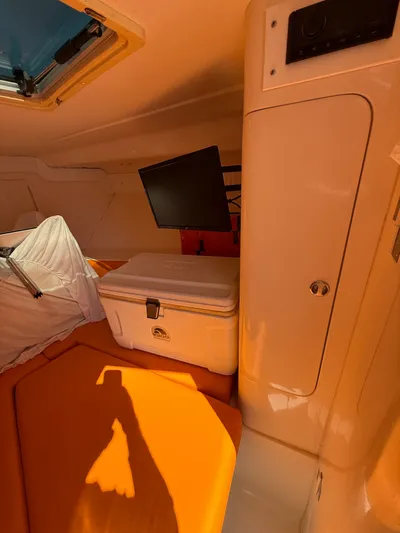  Yacht Photos Pics Interior of a 2000 Intrepid 356 boat with cooler and monitor.