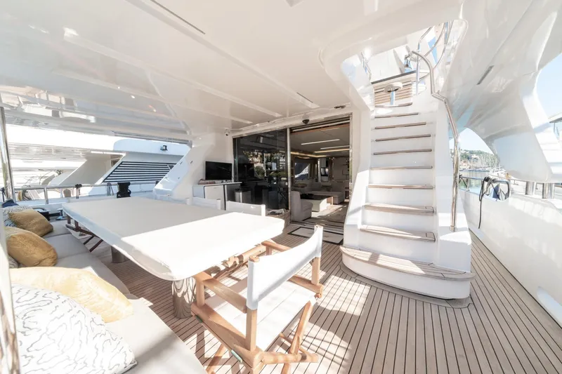  Yacht Photos Pics Luxurious 2013 Benetti Delfino 93 yacht deck with seating and staircase.