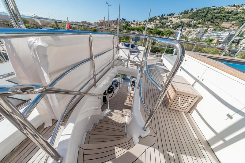  Yacht Photos Pics Luxurious 2013 Benetti Delfino 93 yacht deck with sleek railings and scenic view.