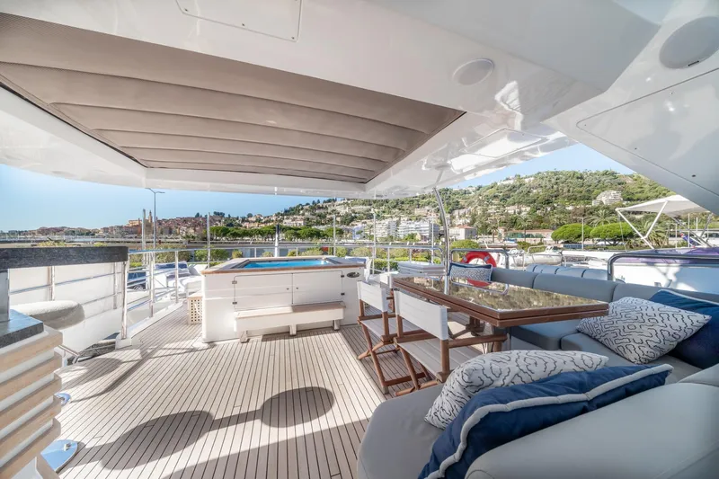  Yacht Photos Pics Luxurious 2013 Benetti Delfino 93 yacht deck with elegant seating and scenic views.