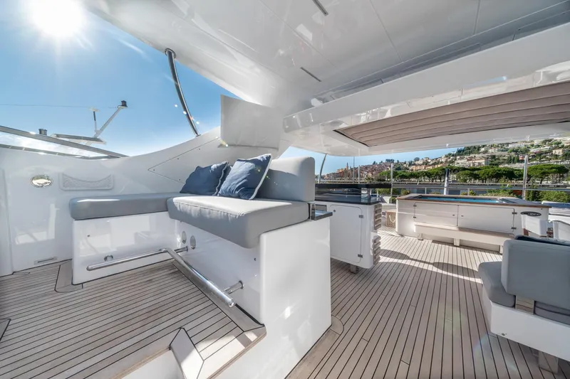  Yacht Photos Pics Luxurious 2013 Benetti Delfino 93 yacht deck with modern seating and scenic views.