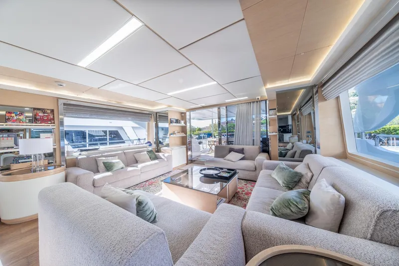  Yacht Photos Pics Luxurious interior of 2013 Benetti Delfino 93 yacht with plush seating and modern decor.