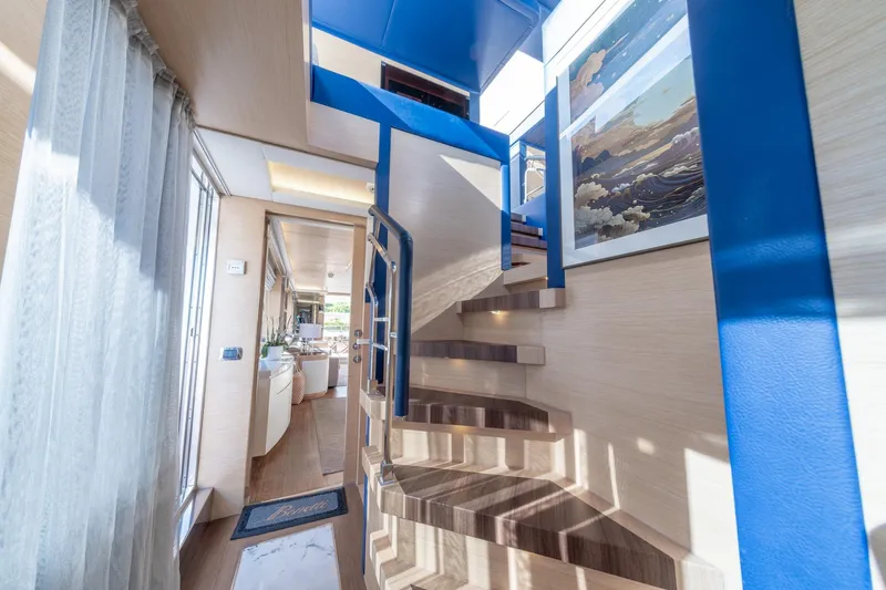  Yacht Photos Pics Interior of 2013 Benetti Delfino 93 yacht with modern staircase and elegant decor.