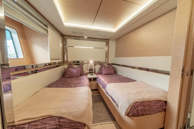  Yacht Photos Pics Luxurious twin bedroom on 2013 Benetti Delfino 93 yacht, featuring modern design and cozy bedding.