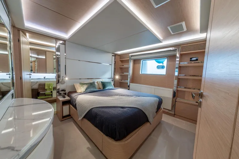  Yacht Photos Pics Luxurious bedroom interior of 2013 Benetti Delfino 93 yacht with modern design and ambient lighting.
