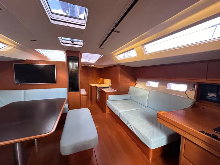 Canteloup VIII Yacht Photos Pics Luxurious interior of 2014 Ice Yachts Ice 62 with modern seating and skylights.