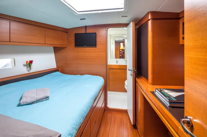 Canteloup VIII Yacht Photos Pics Luxurious 2014 Ice Yachts Ice 62 cabin with wooden interior and modern amenities.