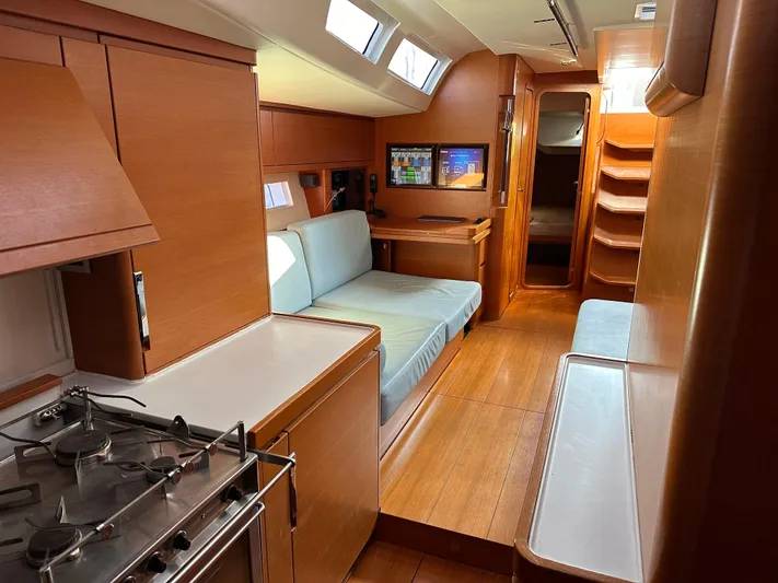 Canteloup VIII Yacht Photos Pics Luxurious interior of 2014 Ice Yachts Ice 62, featuring modern kitchen and cozy seating area.
