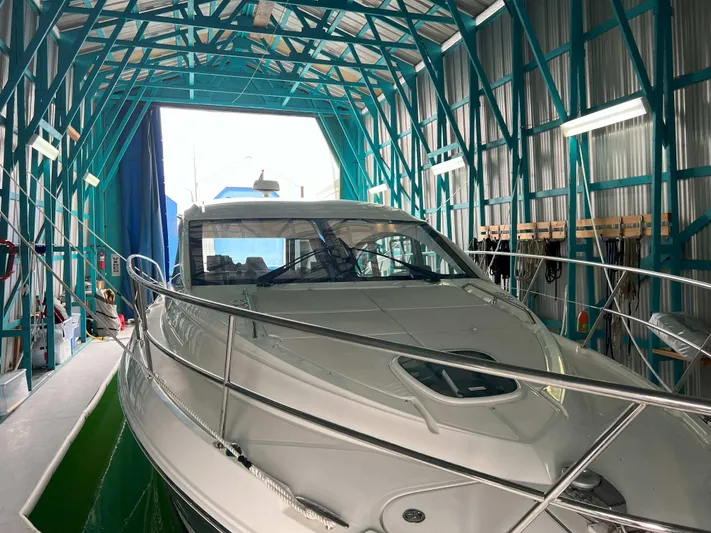 The Good Life Yacht Photos Pics 2018 Sea Ray 400 Sundancer yacht in a boat storage facility.
