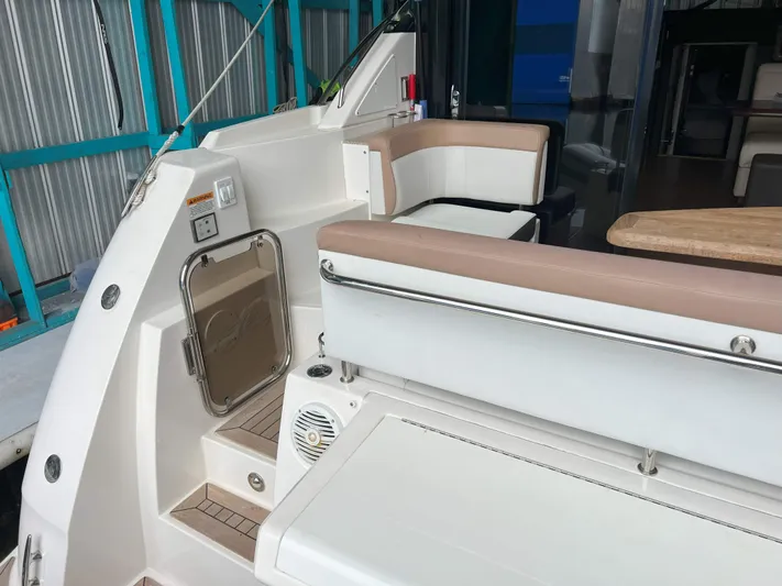 The Good Life Yacht Photos Pics 2018 Sea Ray 400 Sundancer yacht interior with seating and table, showcasing luxury design.