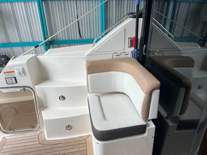 The Good Life Yacht Photos Pics 2018 Sea Ray 400 Sundancer interior with seating and steps in a marina setting.