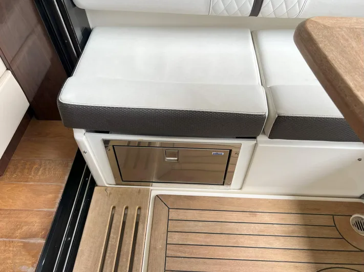 The Good Life Yacht Photos Pics Interior seating and storage on 2018 Sea Ray 400 Sundancer yacht.