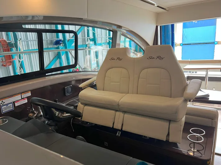 The Good Life Yacht Photos Pics Interior of 2018 Sea Ray 400 Sundancer yacht with plush seating and modern helm.