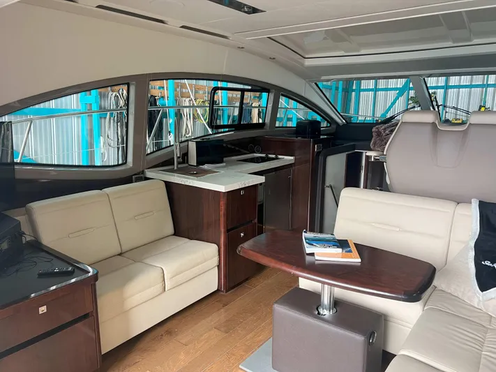 The Good Life Yacht Photos Pics Luxurious interior of 2018 Sea Ray 400 Sundancer yacht with modern furnishings.