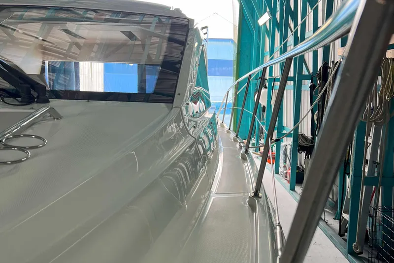 The Good Life Yacht Photos Pics 2018 Sea Ray 400 Sundancer yacht in a marina, showcasing sleek design and polished railings.