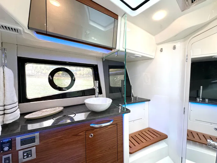 Blue Reeler Yacht Photos Pics Luxurious interior of 2023 Boston Whaler 405 Conquest boat with modern amenities and sleek design.