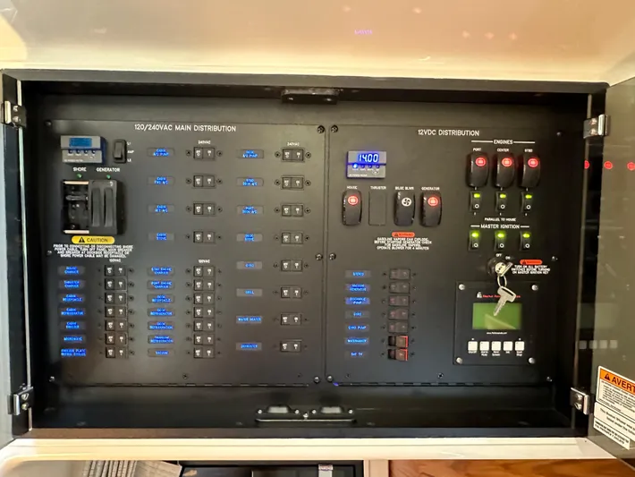 Blue Reeler Yacht Photos Pics Electrical panel of 2023 Boston Whaler 405 Conquest boat, featuring AC/DC distribution controls.