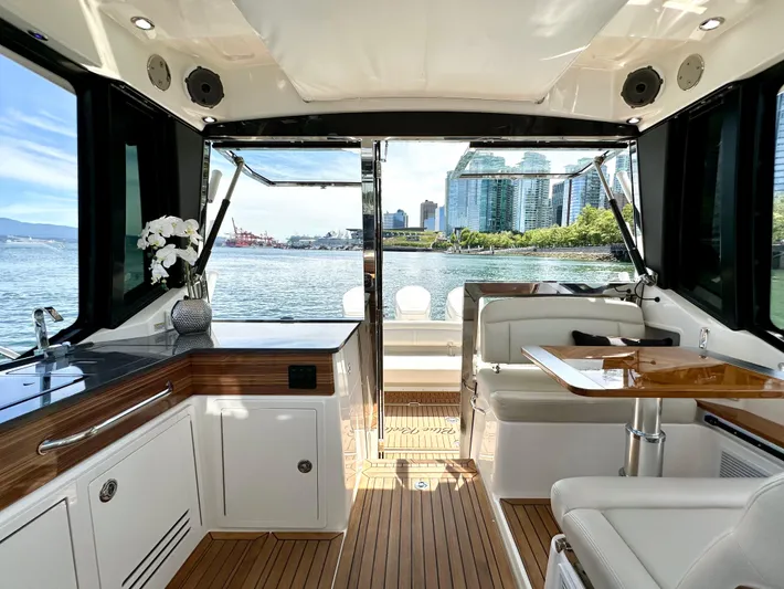 Blue Reeler Yacht Photos Pics Interior of 2023 Boston Whaler 405 Conquest yacht with city skyline view.