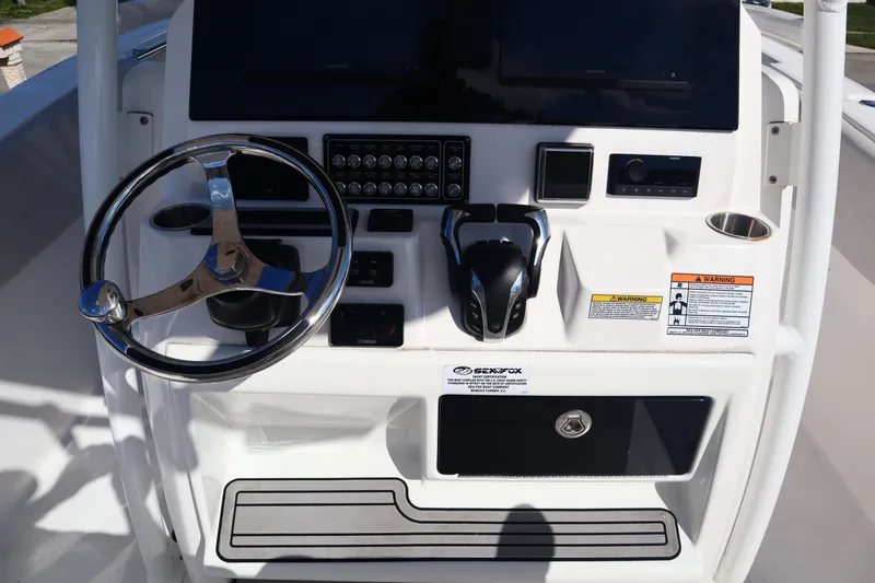  Yacht Photos Pics Control panel of 2022 Sea Fox 288 Commander boat with steering wheel and controls.