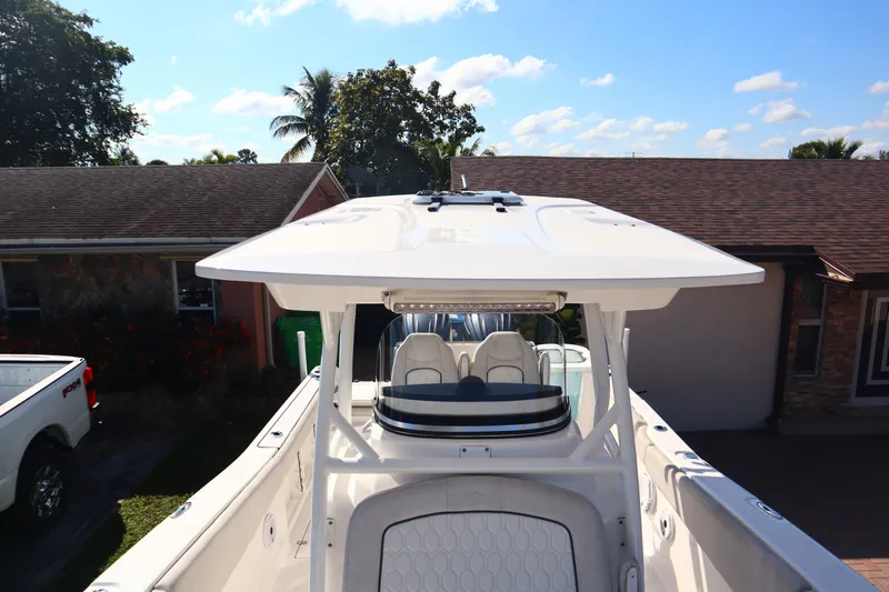  Yacht Photos Pics 2022 Sea Fox 288 Commander boat with T-top, parked in residential driveway.