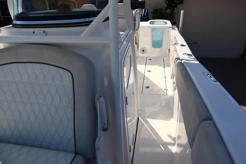  Yacht Photos Pics 2022 Sea Fox 288 Commander boat interior with white seating and sleek design.