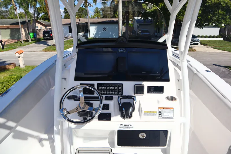  Yacht Photos Pics 2022 Sea Fox 288 Commander boat console with steering wheel and controls.