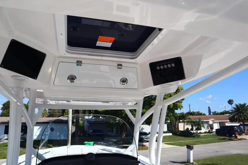  Yacht Photos Pics 2022 Sea Fox 288 Commander boat console with overhead storage and controls.