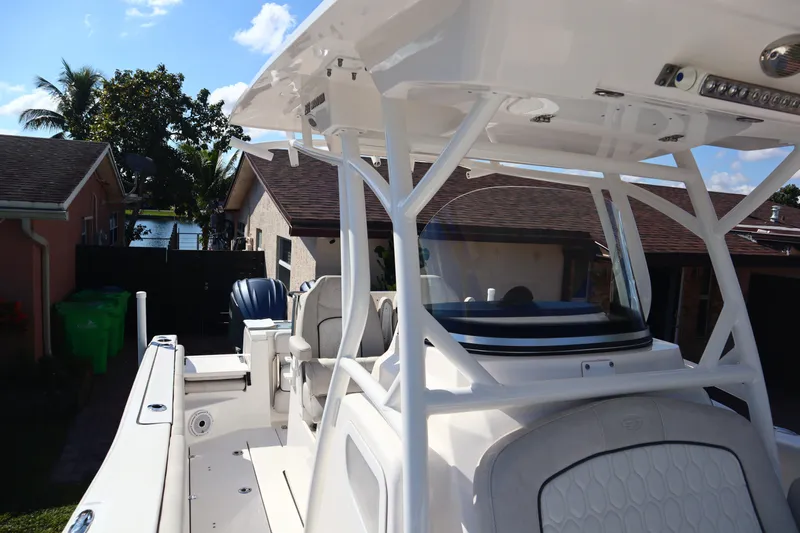  Yacht Photos Pics 2022 Sea Fox 288 Commander boat with T-top, parked near residential homes.