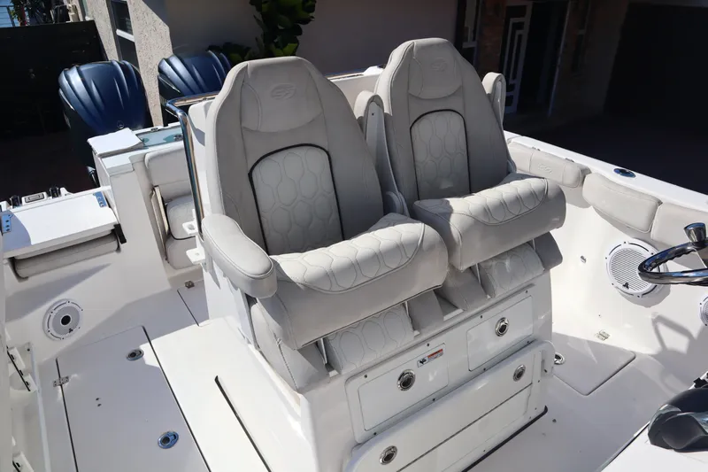  Yacht Photos Pics 2022 Sea Fox 288 Commander boat with dual cushioned seats and storage compartments.