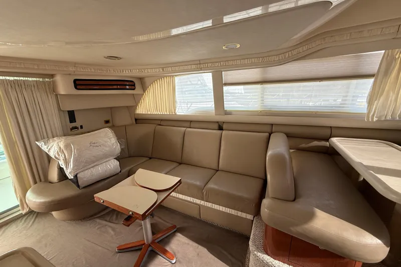  Yacht Photos Pics Luxurious interior of 1998 Sea Ray 480 Sedan Bridge with beige leather seating.