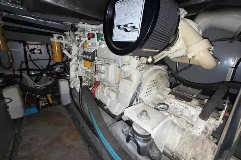  Yacht Photos Pics Engine room of a 1998 Sea Ray 480 Sedan Bridge yacht, showcasing mechanical components.