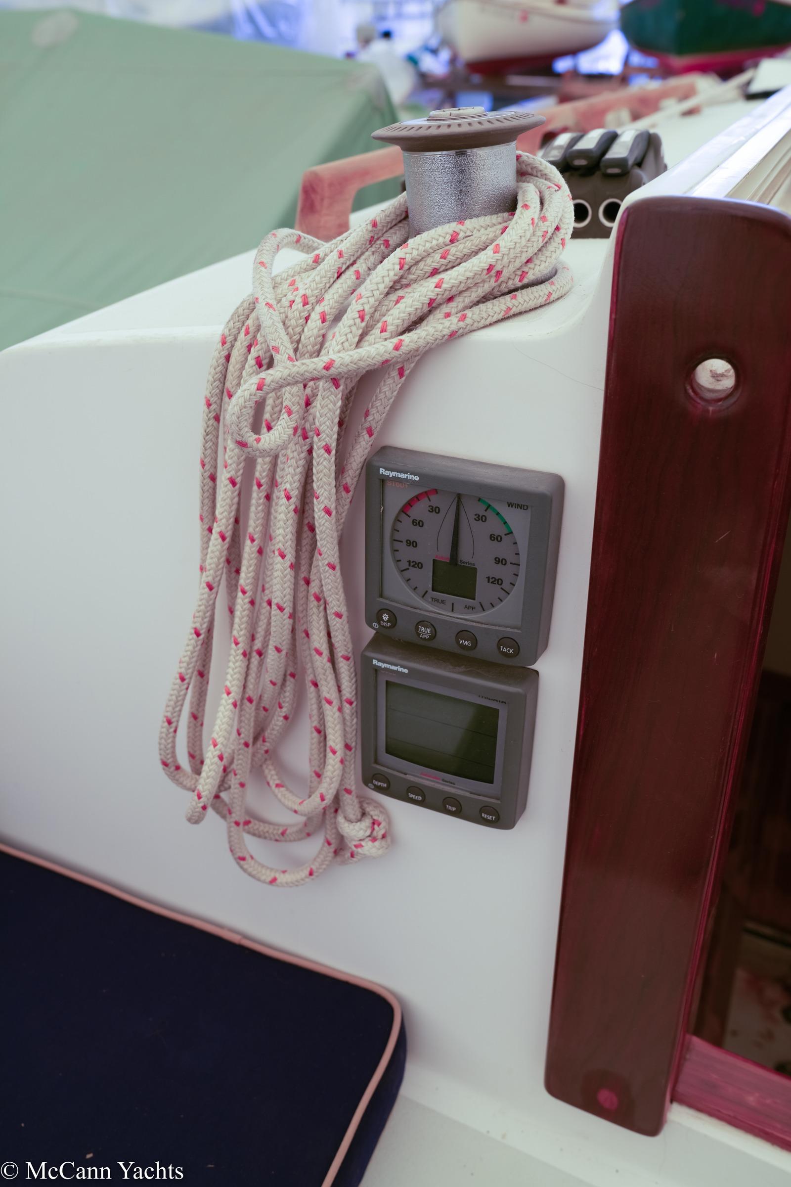 Close-up of 2002 Alerion Express 28 sailboat cockpit instruments and rope.