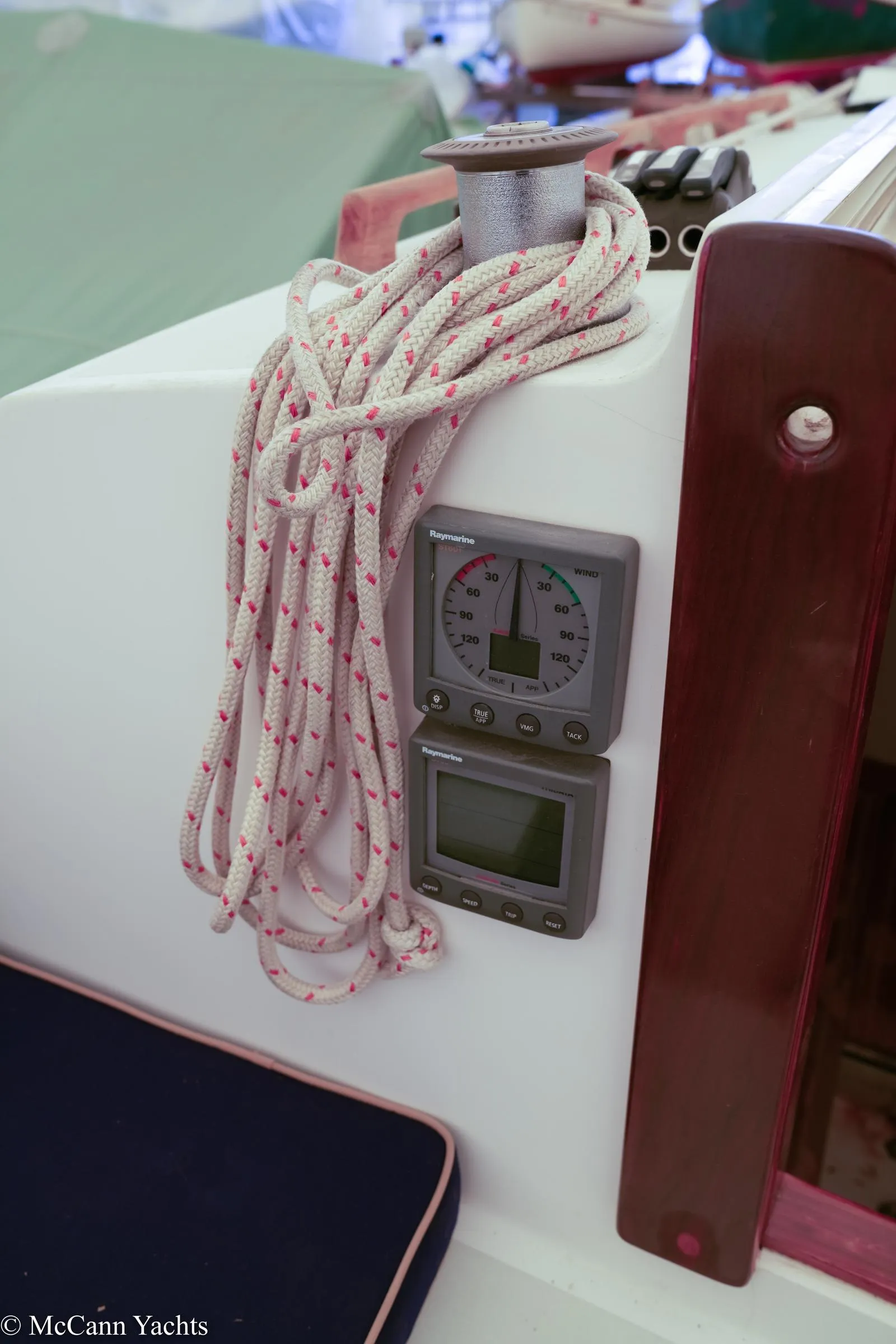 Close-up of 2002 Alerion Express 28 sailboat cockpit instruments and rope.