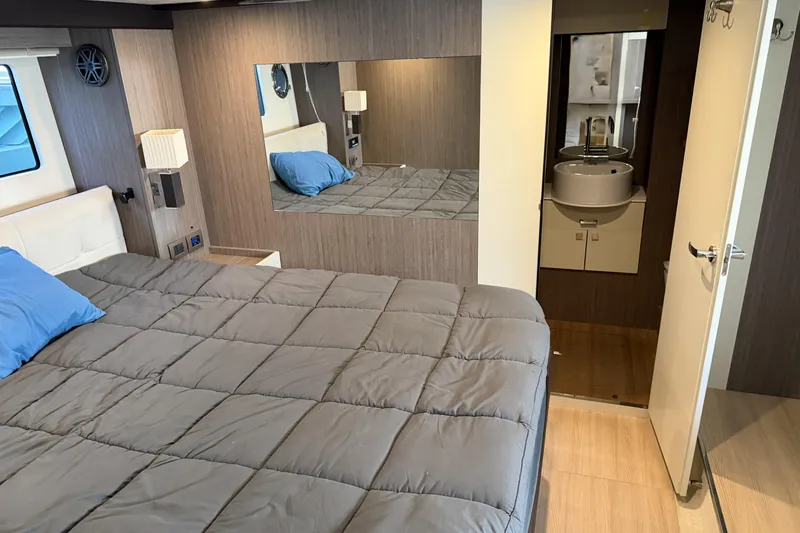  Yacht Photos Pics Interior of 2016 Cranchi Eco Trawler 53 Long Distance with cozy bedroom and ensuite bathroom.