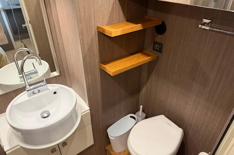  Yacht Photos Pics Bathroom interior of 2016 Cranchi Eco Trawler 53 Long Distance with sink and toilet.