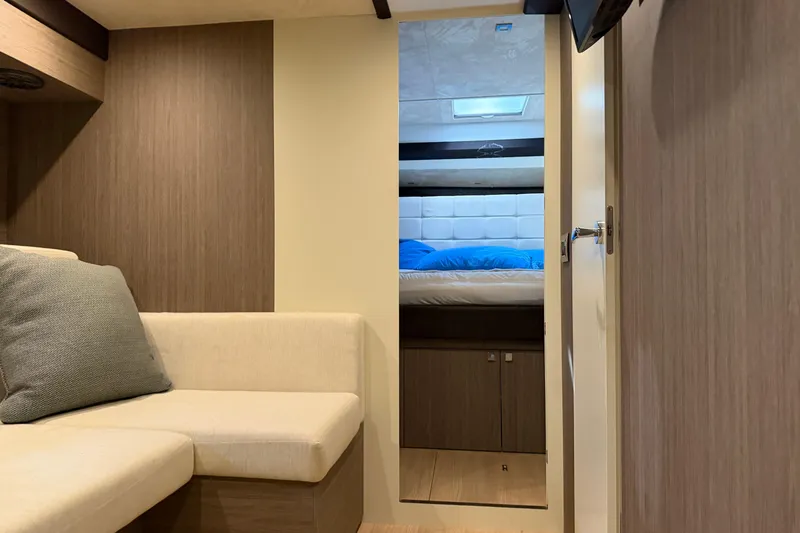  Yacht Photos Pics Interior of 2016 Cranchi Eco Trawler 53 Long Distance, featuring cozy seating and bedroom.