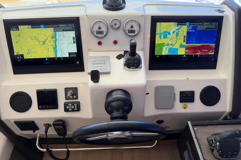  Yacht Photos Pics Cockpit of 2016 Cranchi Eco Trawler 53 with navigation screens and controls.