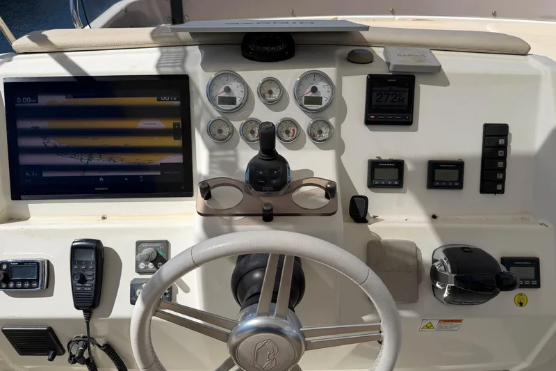  Yacht Photos Pics Helm of 2016 Cranchi Eco Trawler 53 Long Distance with navigation instruments and controls.