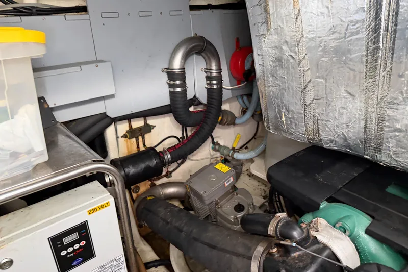  Yacht Photos Pics Engine room of 2016 Cranchi Eco Trawler 53 Long Distance, showcasing mechanical components.