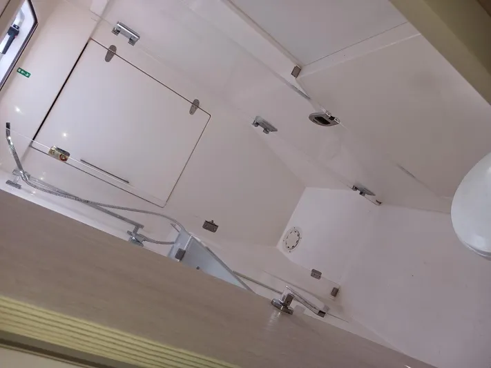 Red Robin Yacht Photos Pics Interior of a 2019 Leopard 40 yacht bathroom with modern fixtures.