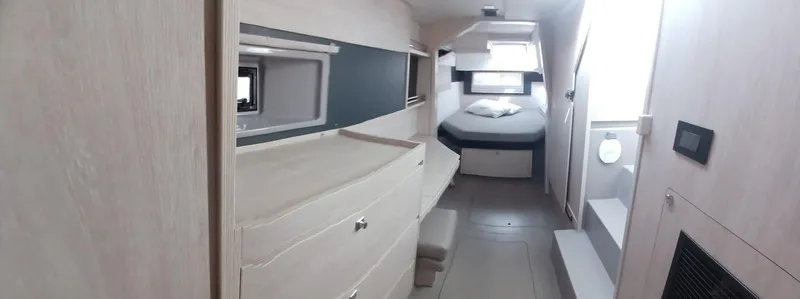 Red Robin Yacht Photos Pics Interior of 2019 Leopard 40 catamaran cabin with modern furnishings and cozy bed.