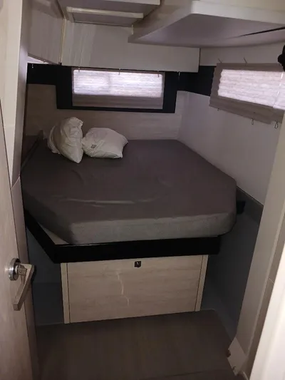 Red Robin Yacht Photos Pics Cozy bedroom in 2019 Leopard 40 catamaran with double bed and windows.