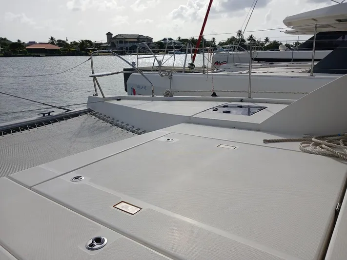 Red Robin Yacht Photos Pics 2019 Leopard 40 catamaran docked by waterfront homes.