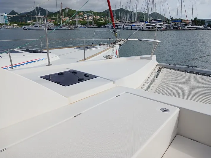 Red Robin Yacht Photos Pics Leopard 40 catamaran deck view in marina, 2019 model, with scenic mountain backdrop.