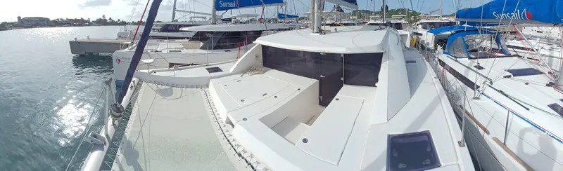 Red Robin Yacht Photos Pics 2019 Leopard 40 catamaran docked in marina, featuring spacious deck and modern design.