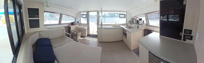 Red Robin Yacht Photos Pics Interior of 2019 Leopard 40 catamaran, featuring modern kitchen and spacious seating area.