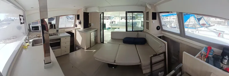 Red Robin Yacht Photos Pics Interior of 2019 Leopard 40 catamaran with modern kitchen and seating area.