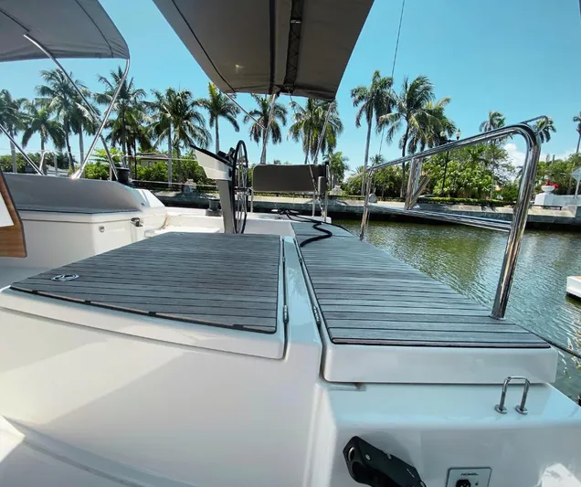 Dufour 530 In Annapolis Yacht Photos Pics 2024 Dufour 530 yacht with spacious deck and tropical marina backdrop.