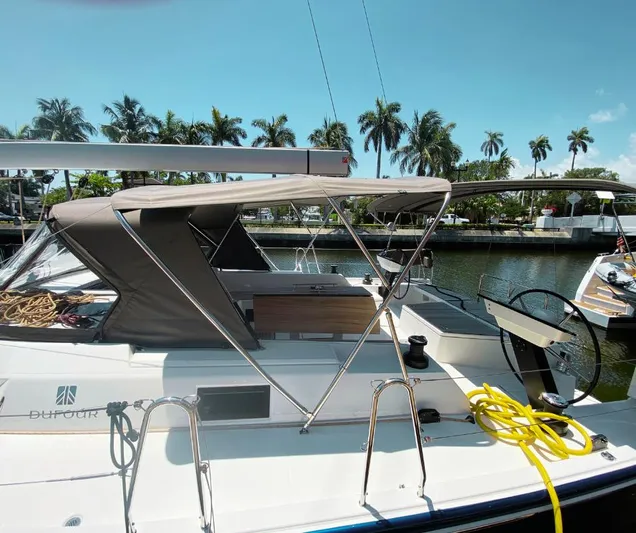 Dufour 530 In Annapolis Yacht Photos Pics 2024 Dufour 530 sailboat docked, featuring a shaded cockpit and modern design.
